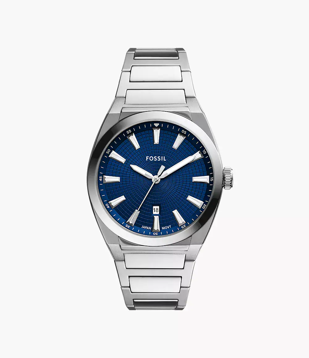 A stainless steel Fossil wristwatch with a blue textured dial, silver hour markers, date window at 6 o'clock, and a metal link bracelet, displayed on a plain white background.